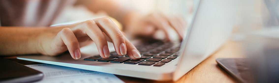 woman using a computer for online classes